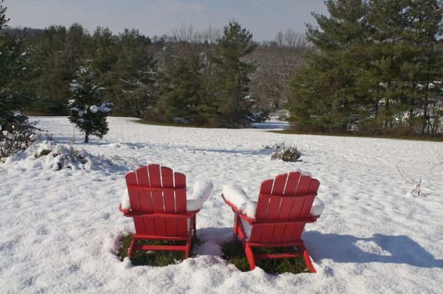 Adirondack chairs in snow